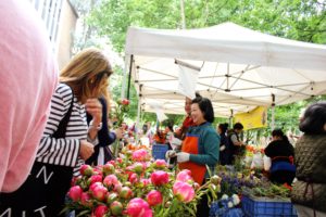 Shopping for fresh flowers at the Portland Farmer's Market.